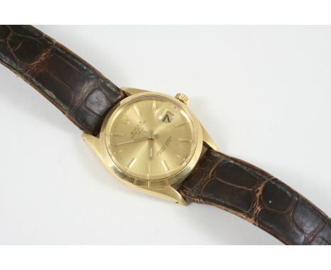 A GENTLEMAN'S 14CT. GOLD OYSTER DATE WRISTWATCH BY ROLEX the signed circular gold dial with baton numerals, model number 1500
