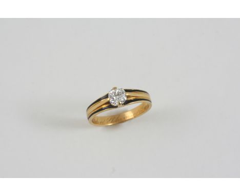 A DIAMOND MOURNING RING the old brilliant-cut diamond is set in an 18ct. gold mount with black enamel decoration, inscribed t