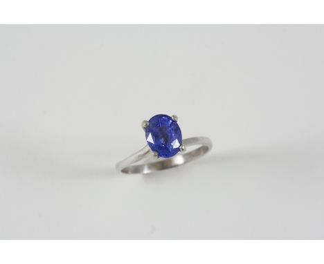 A SAPPHIRE SINGLE STONE RING set with an oval-shaped sapphire weighing 3.05 carats. Size P 1/2.