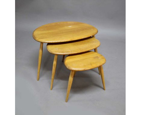 ERCOL 'PEBBLE' NEST OF TABLES a set of three light coloured elm 'Pebble' coffee tables, also with a light coloured elm three 