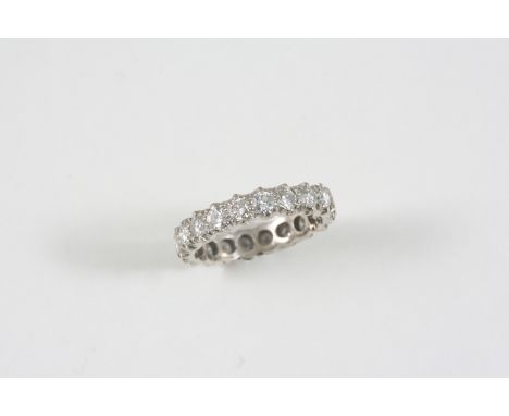 A DIAMOND FULL CIRCLE ETERNITY RING set with circular-cut diamonds weighing approximately 3.0 carats in total. Size R 1/2.