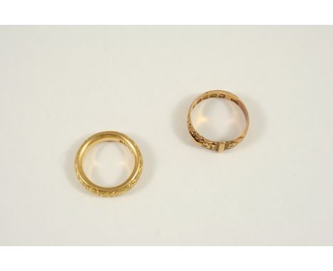 AN 18CT. GOLD FOLIATE ENGRAVED RING 9.2 grams, size K, together with an 18ct. gold foliate engraved buckle ring, 3.9 grams, s