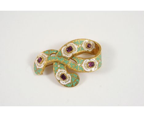A 19TH CENTURY CONTINENTAL ENAMEL BROOCH the swirling design is decorated with green and white enamel with gold decoration se