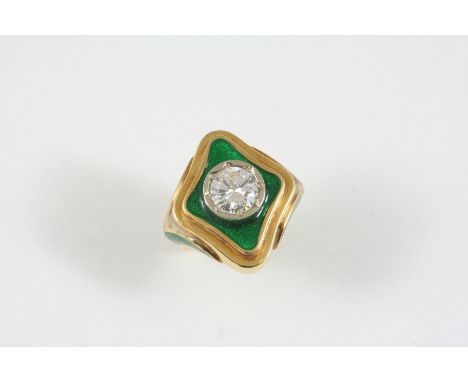 A DIAMOND SOLITAIRE RING the brilliant-cut diamond is set within a surround of green guilloche enamel decoration, the same de