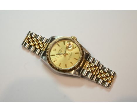 A GENTLEMAN'S STAINLESS STEEL AND GOLD OYSTER PERPETUAL DATEJUST WRISTWATCH BY ROLEX the signed circular dial with baton nume