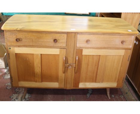EARLY ERCOL SIDEBOARD – WINDSOR a light elm sideboard with two drawers, the cupboard doors secured by a sliding latch. With s