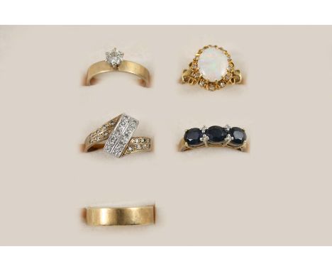 FIVE ASSORTED GOLD AND GEM SET RINGS including a diamond solitaire ring, set in gold, size M 1/2, an opal and diamond cluster