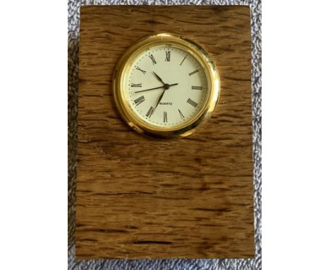 HMS Victory piece of oak approx 3 x 2 x 1 inches with Quartz Clock inset on one side and carved to bottom HMS Victory Trafalg