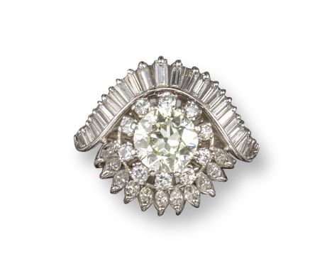 A diamond cluster ring, centred with an old circular-cut diamond weighing 2.06cts, set within a surround of round brilliant-c