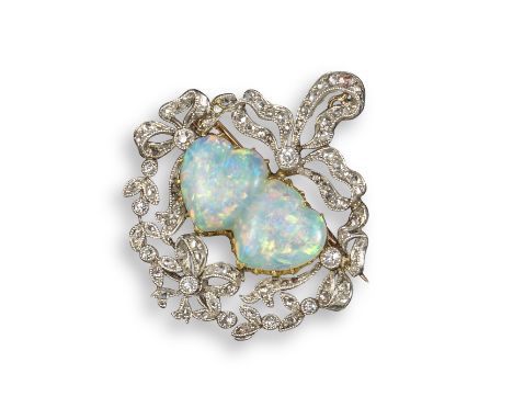 An Edwardian opal and diamond brooch pendant, centred with a double heart-shaped opal within a foliate and bow surround, set 