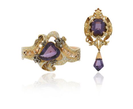 A Victorian white enamel and amethyst-set gold bangle, the heart-shaped amethyst is set within pierced scrolling mount decora