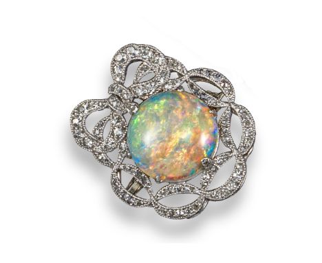 An Edwardian opal and diamond brooch, centred with a circular-shaped opal in an openwork surround of single-cut diamonds and 