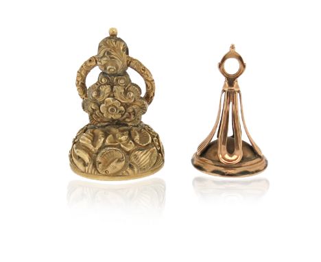 A Regency fob seal, with repoussé shell decoration, suspended from a split ring, with a carnelian matrix engraved with a coat