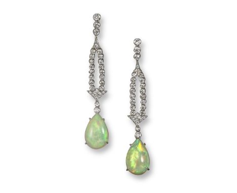 A pair of opal and diamond drop earrings, the pear-shaped opal cabochons suspend from articulated lines of circular-cut diamo