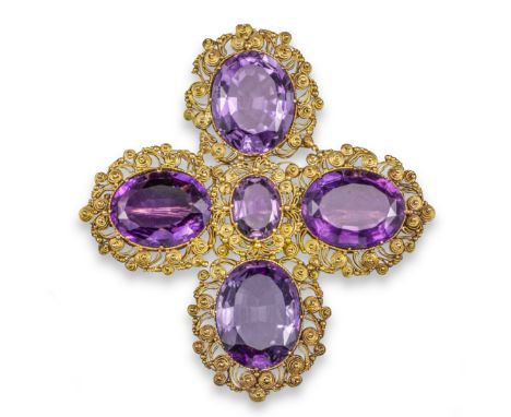 A Regency amethyst brooch, set with graduated oval-shaped amethysts in gold cannetille surround, 7.5cm high