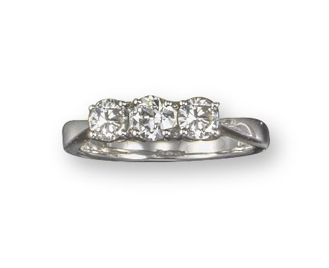 A diamond three-stone ring, set with an old circular-cut diamond and two round brilliant-cut diamonds in platinum, size M