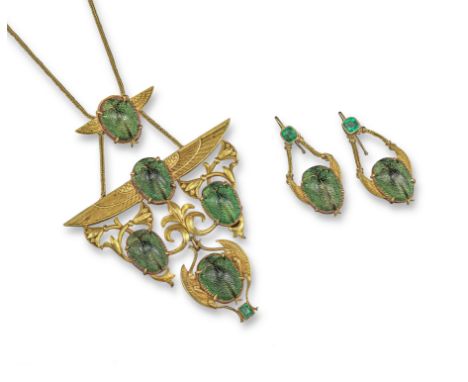 An Art Nouveau Egyptian Revival gold pendant, decorated with stylised lotus flowers, wings set with green scarab beetles and 