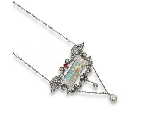 A opal, diamond and ruby pendant, centred with a rectangular opal plaque, the scrolling mount set with old circular-cut diamo