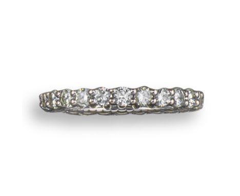 A diamond full-circle eternity ring, claw-set with round brilliant-cut diamonds in white gold, estimated total diamond weight