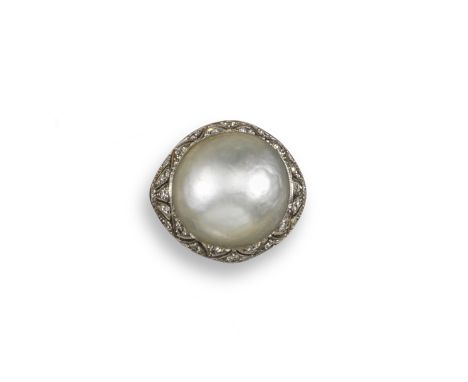 A cultured pearl and diamond ring, the cultured pearl is set in a diamond-set platinum mount with openwork geometric design a