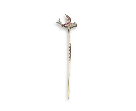 A Victorian ruby and diamond bird stick pin, pave-set with graduated rose-cut and cushion-shaped diamonds and rubies in silve