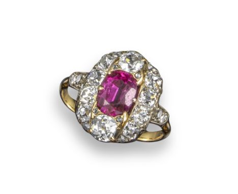 A 19th century ruby and diamond cluster ring, centred with an oval-shaped ruby within old-cushion-shaped diamond border and s