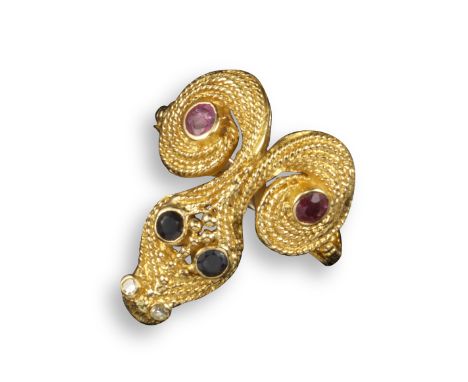 A sapphire, ruby and diamond snake ring by Lalaounis, with ropetwist and pellet decoration in yellow gold, signed and with ma