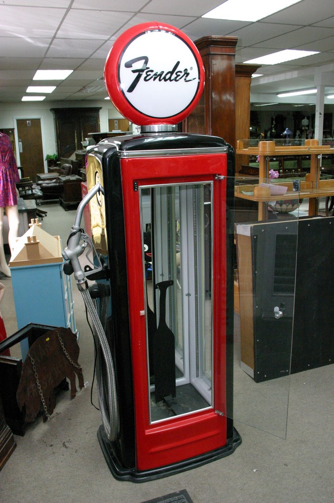 A Fender guitar petrol pump display case