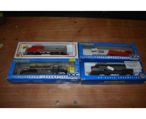 Four Bachmann HO Scale Locomotives, New York Central, Santa Fe and unnamed, all with boxes