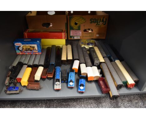 A Shelf of Hornby, Triang, Kit Master and similar 00 gauge including Thomas the Tank Engine, carriages and wagons