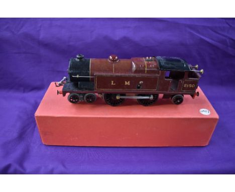 A Hornby 0 gauge clockwork 4-4-2 Tank Engine in LMS maroon and black livery, numbered 2180, in reproduction box