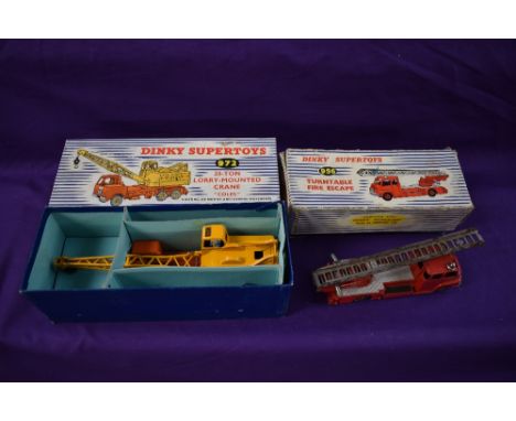 Five Dinky Supertoys diecasts, Fire Engine x2 955, Turntable Fire Escape 956, Euclid Rear Dump Truck 965 and 20 Ton Lorry Mou