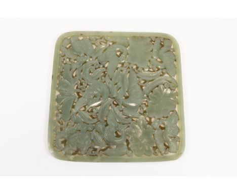 A Chinese Green Carved Jade Plaque Depicting Floral Patterns & Birds from the 19th Century.Approximately 12.8cm x 13.3cm 