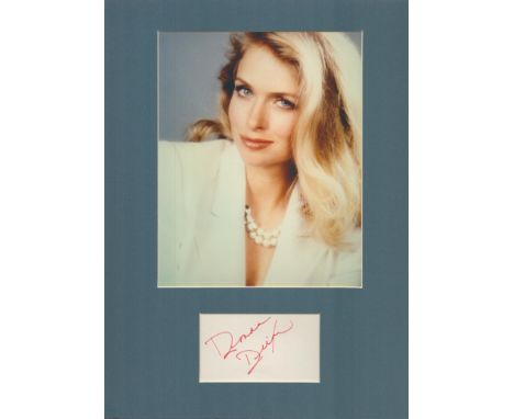 Actor, Donna Dixon matted signature piece, overall size 16x12. This beautiful item features a colour photo and a signed white