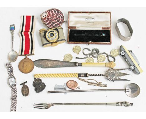 A mixed lot to include a Petie miniature camera, a shell snuff box, a Sarome Blue Bird lighter various badges, plated ware et