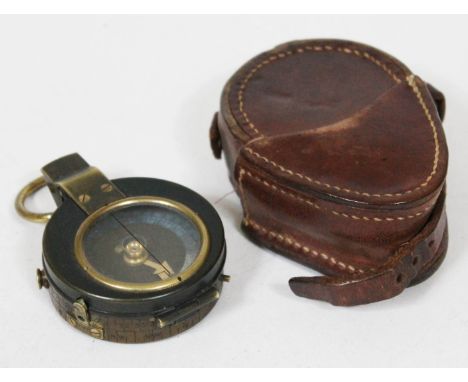 A WWI metal compass no 46196 with leather case.