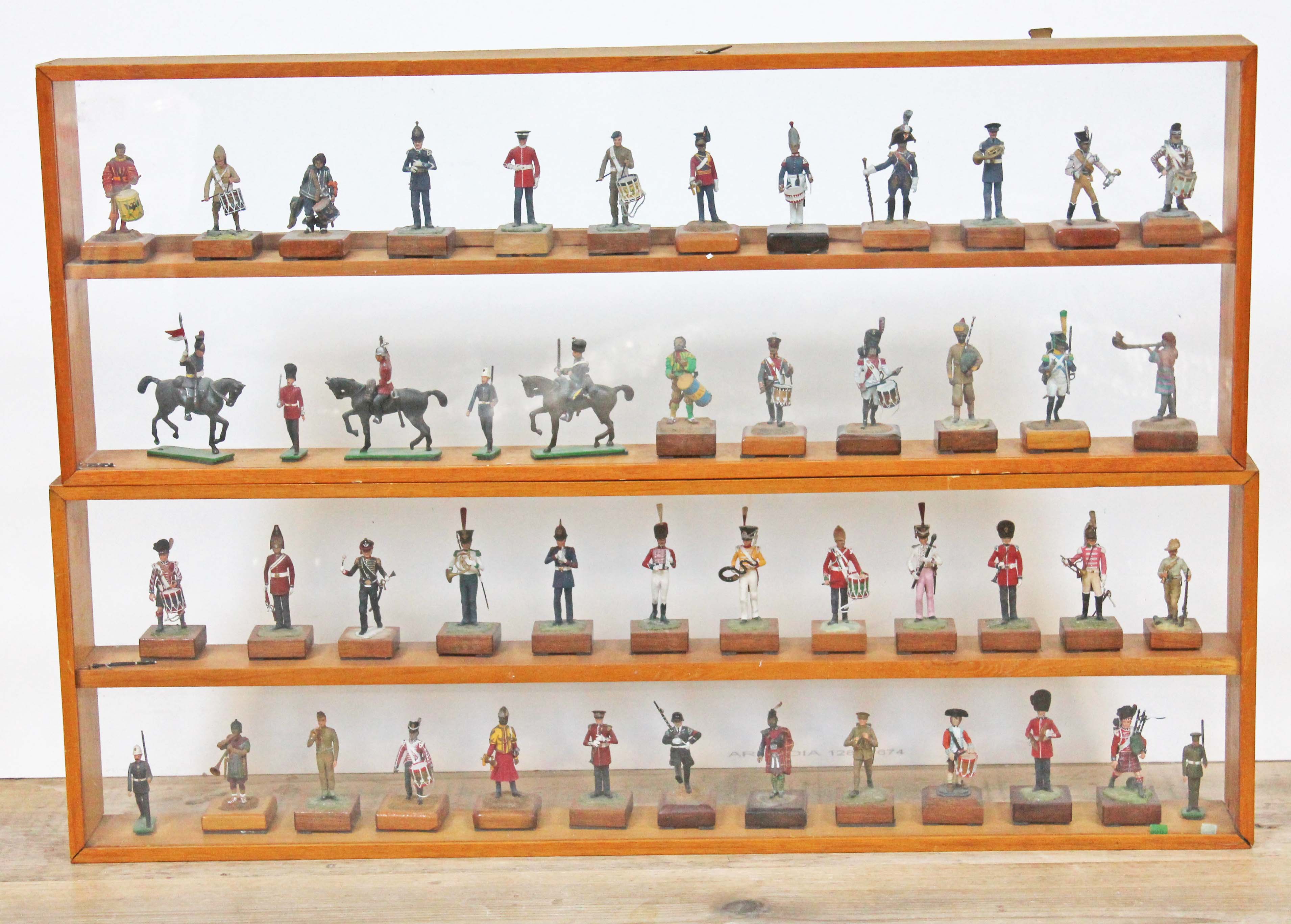 Two display cases containing hand painted soldiers.