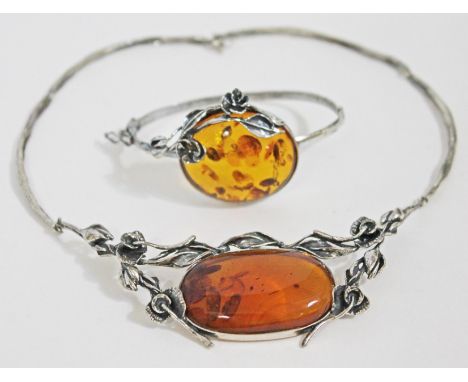 A Continental white metal necklace set with an amber cabochon and matching bangle, both marked '925'.