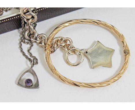 A mixed lot comprising a Scandinavian silver pendant set with a purple stone marked '925 Finland', a yellow metal bangle mark