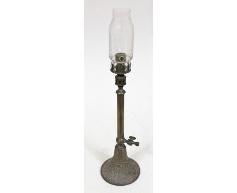 A Victorian cast metal gas lamp with glass flue, height 52.5cm.