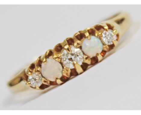 A diamond opal ring, band indistinctly marked, gross wt. 2.4g, size Q, with box, diamonds vibrant and bright, no inclusions v