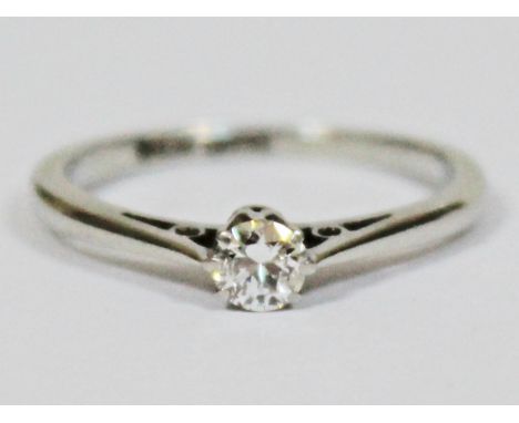 A diamond solitaire ring, the stone approx. 0.20 carats, marked '18ct PLAT', gross wt. 1.9g, size K, with box.