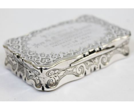 A Victorian bright cut engraved silver table snuff box with shaped edge, Frederick Marson, Birmingham 1872, length 8cm.