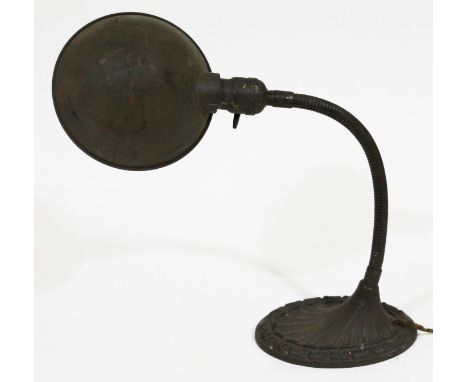 An American adjustable table lamp with cast metal base, max height 57cm.