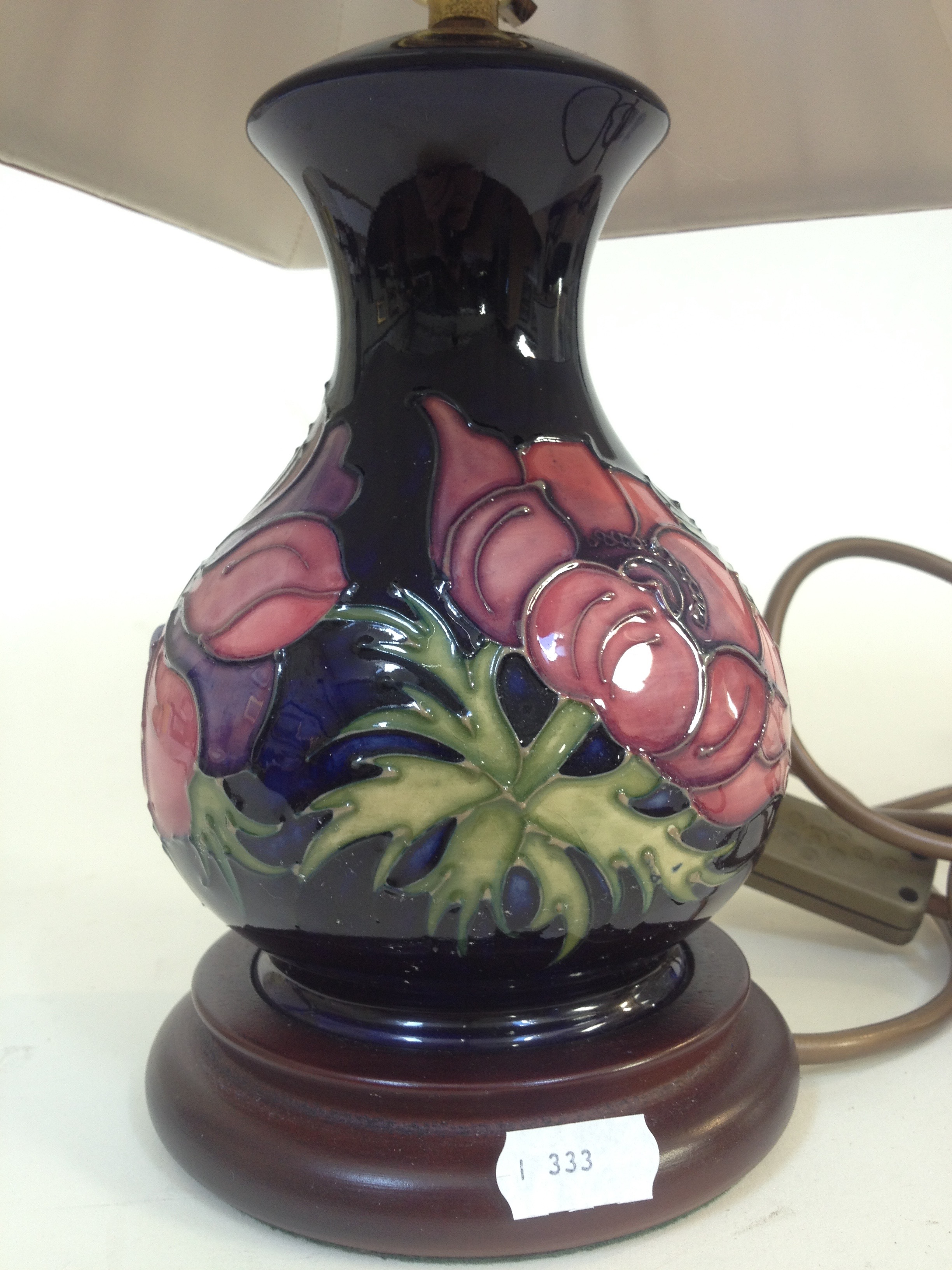 Two Moorcroft pottery table lamps, height 33cm & 39cm (including shades).