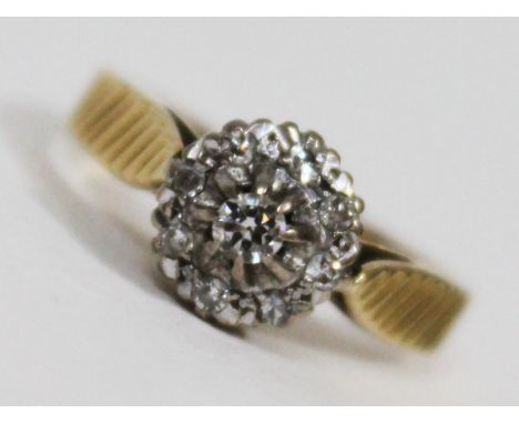 A hallmarked 18ct gold diamond cluster ring, gross wt. 3.1g, size K/L.