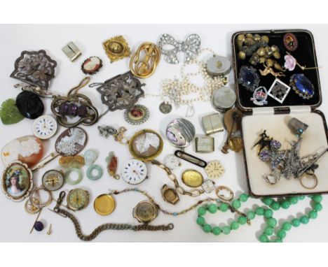 A mixed lot of costume jewellery, jade, watch movements etc.