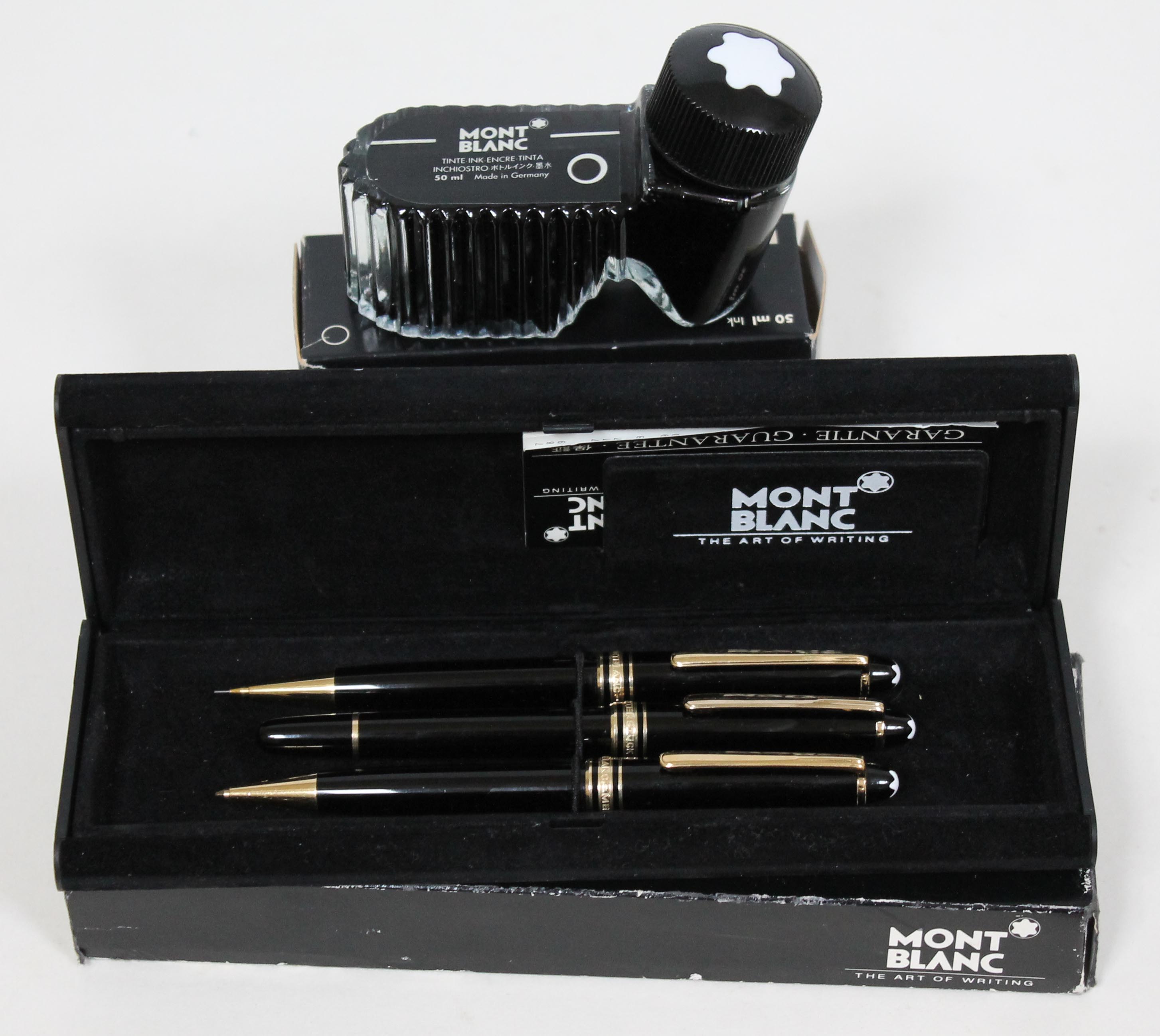 A Mont Blanc pen and pencil set with 50ml ink bottle.