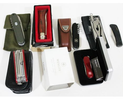 A group of seven penknives including Swiss Army, Opinel, Sog etc.