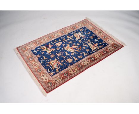 PERSIAN KASHAN PART-SILK, FINELY KNOTTED, PICTORIAL HUNTING RUG depicting five equestrian figures and numerous running deer, 
